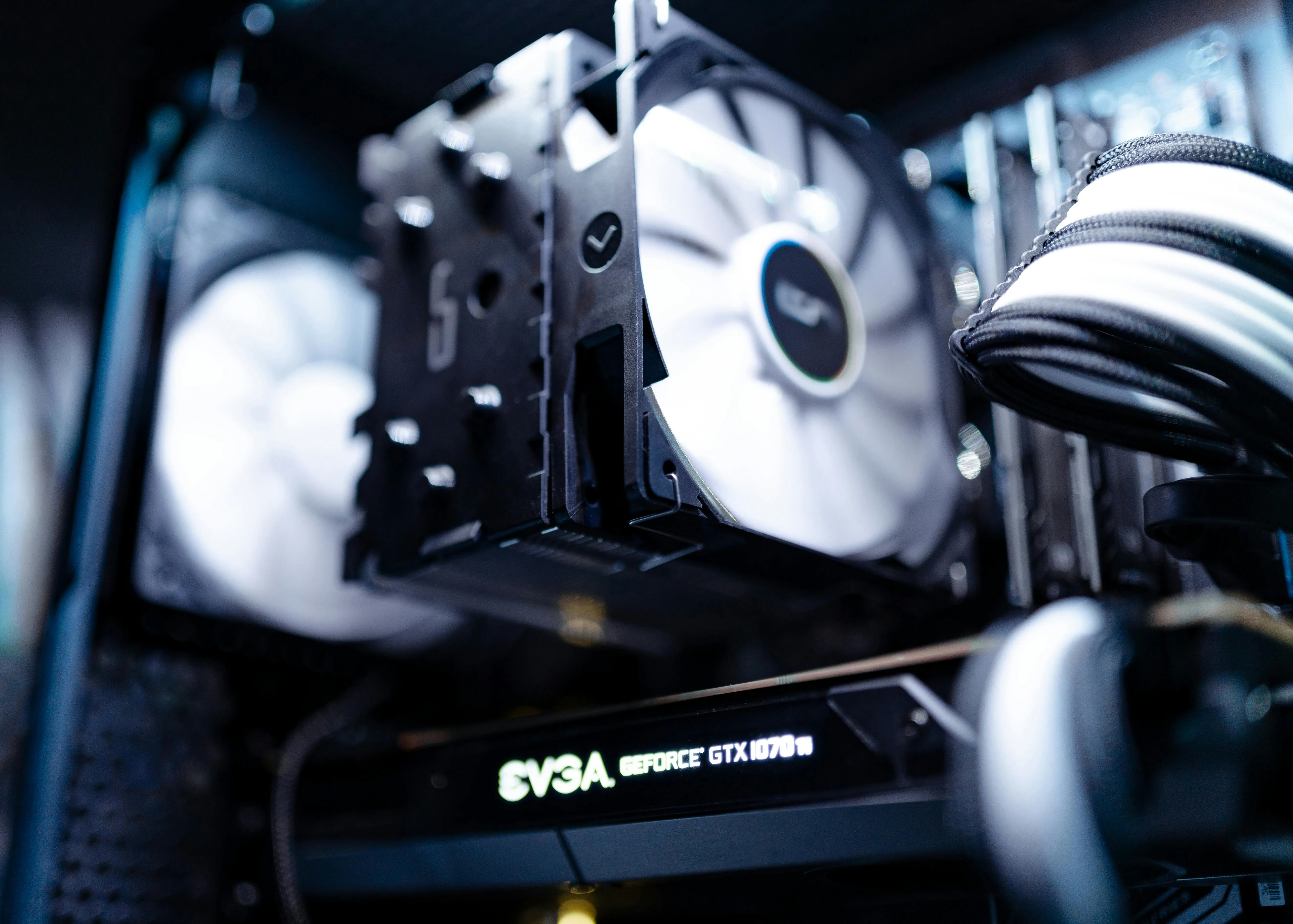 inside a desktop computer with a glowing graphics card.